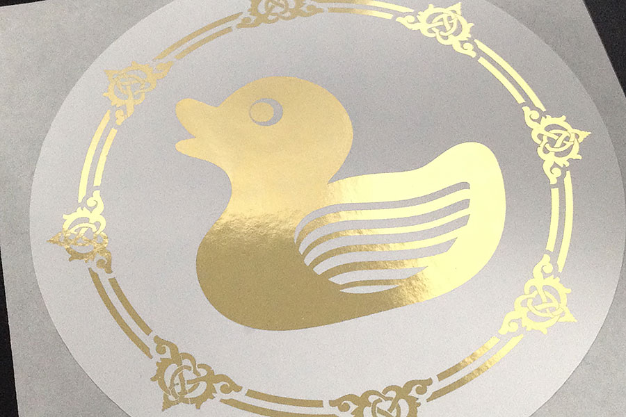 Metallic gold duck on white paper sticker label